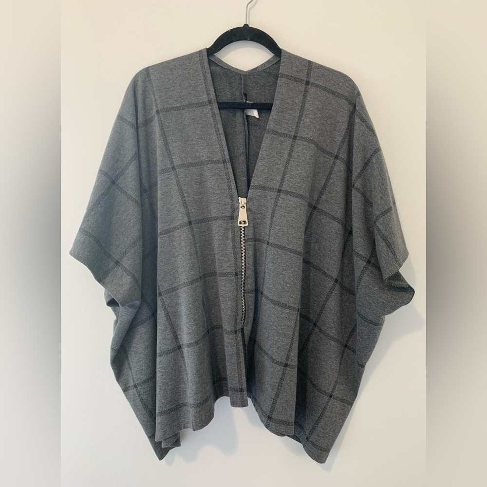 Grey and black poncho with large zipper
